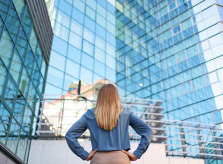 woman attorney looking at building