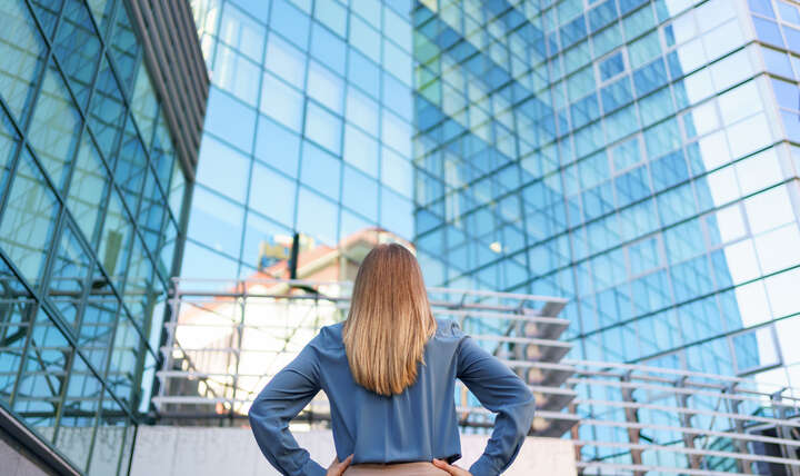 woman attorney looking at building